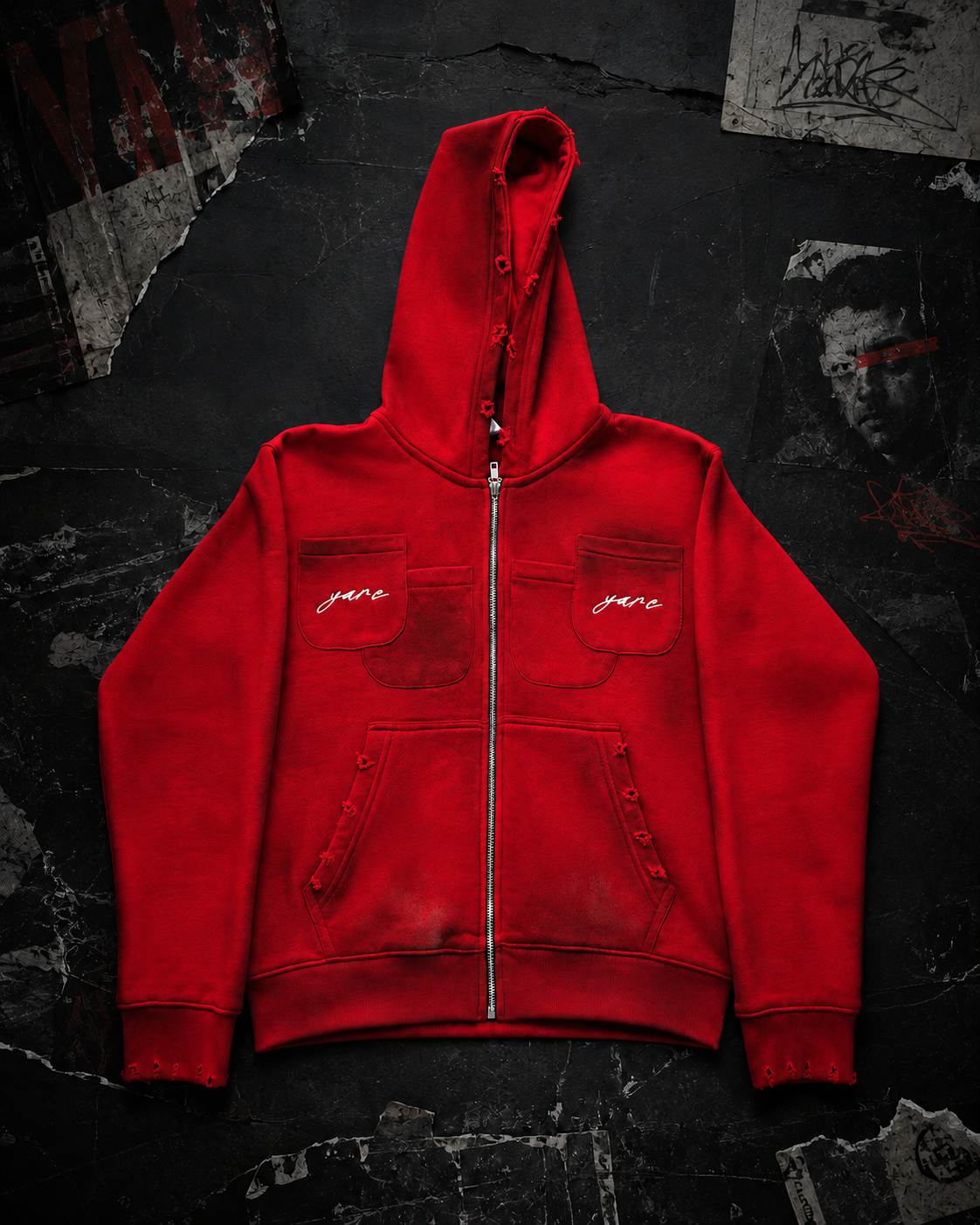 Front detail of the red Double Pocket YARE Jacket showing the zip closure and embroidered chest pockets